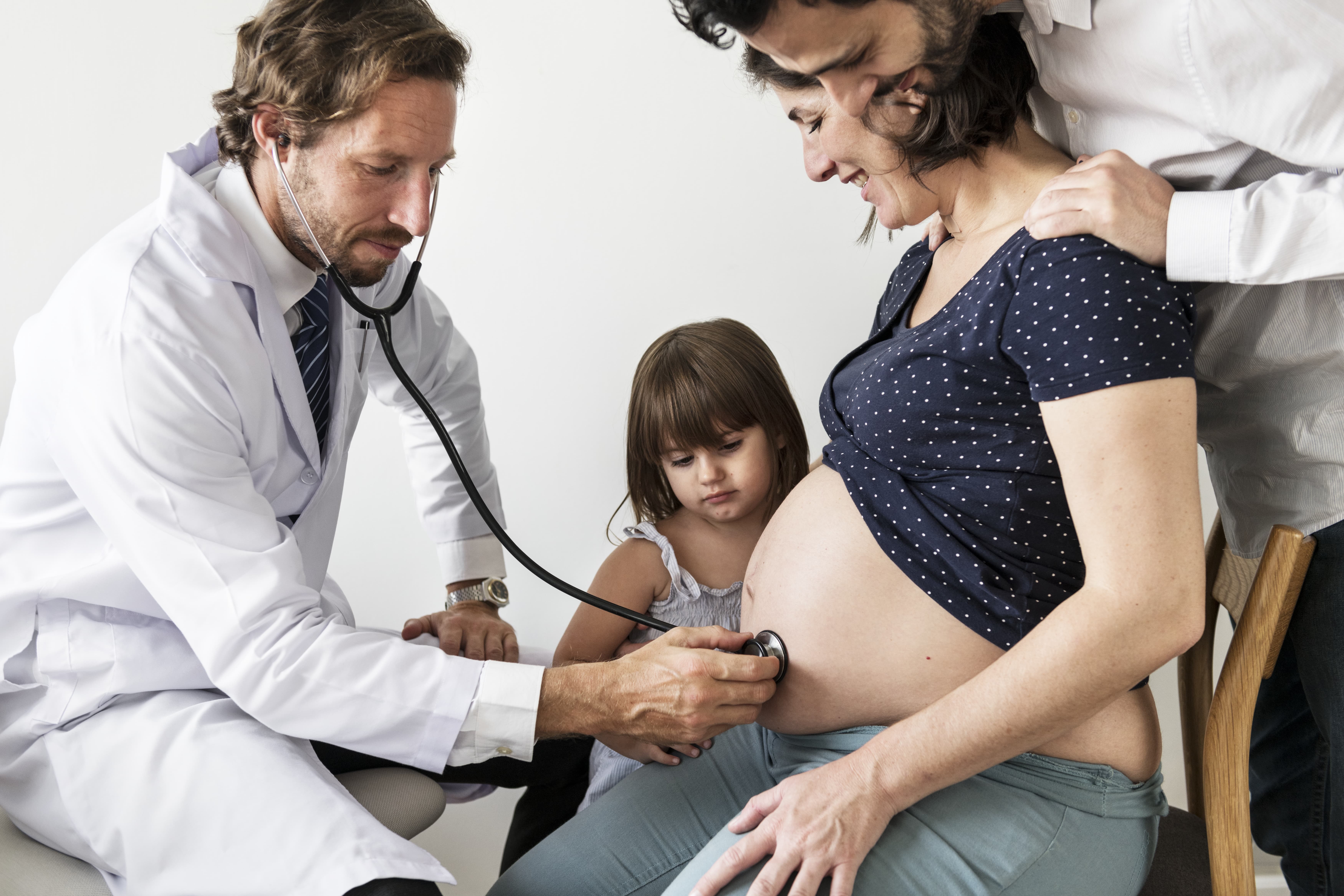 pregnant-woman-having-fetal-monitoring-by-doctor-min
